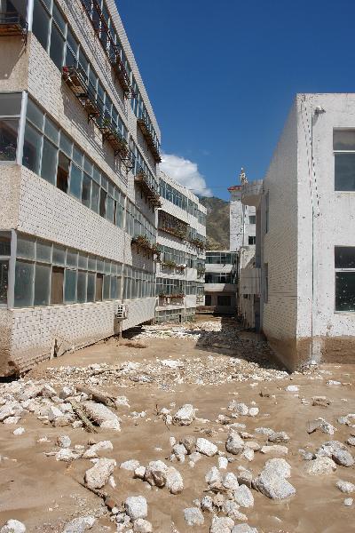 Mud and stones are seen at a community in Zhouqu County, Gannan Tibetan Autonomous Prefecture in northwest China's Gansu Province, Aug. 8, 2010.