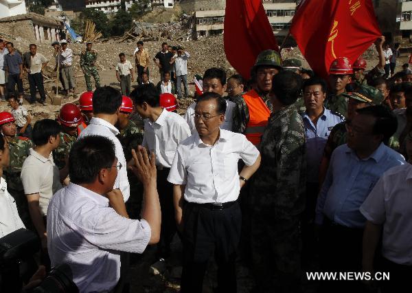 Chinese Premier Wen Jiabao inspects the landslide-hit region in Zhouqu County, Gannan Tibetan Autonomous Prefecture in northwest China's Gansu Province, Aug. 8, 2010. 