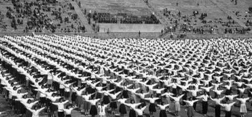 Staff workers perform radio gymnastic exercises at a sports meeting for workers in East China's Jiangsu province in this file photo taken on May 12, 1956. [Xinhua] 