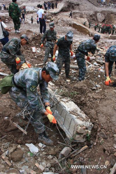 Soldiers take part in the rescue work in landslides-hit Zhouqu County, Gannan Tibetan Autonomous Prefecture in northwest China's Gansu Province, Aug. 9, 2010. 