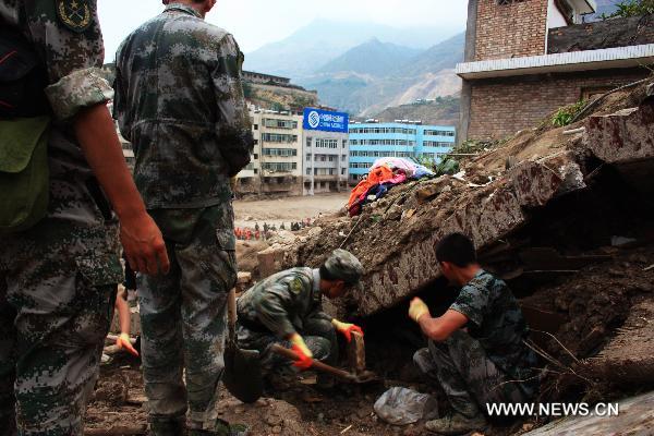 Soldiers take part in the rescue work in landslides-hit Zhouqu County, Gannan Tibetan Autonomous Prefecture in northwest China's Gansu Province, Aug. 9, 2010. 