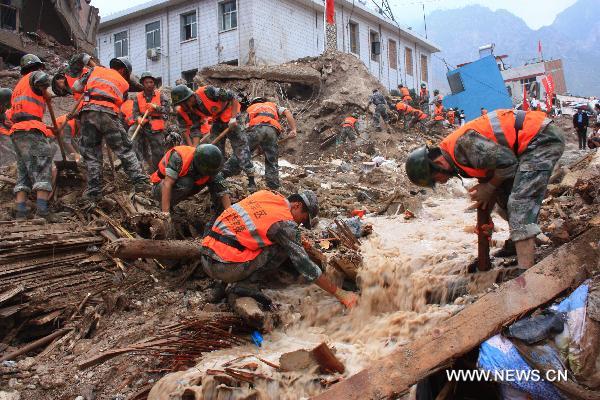 Soldiers take part in the rescue work in landslides-hit Zhouqu County, Gannan Tibetan Autonomous Prefecture in northwest China's Gansu Province, Aug. 9, 2010. 