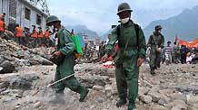 Soldiers sterilize the landslide-hit area in Zhouqu County, northwest China's Gansu Province, Aug. 10, 2010.