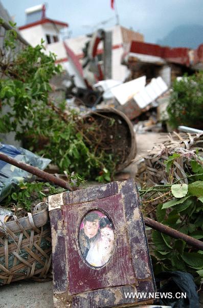 The photo taken on Aug. 9, 2010, shows a wedding photo album lying in the debris.