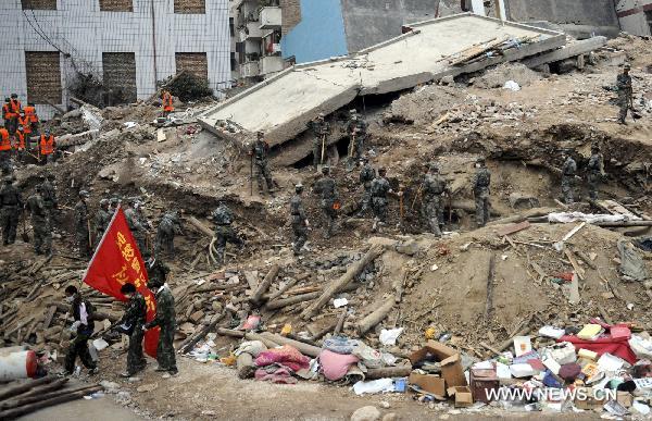 Soldiers search for survivors trapped under debris in the Aug. 7 landslides in Zhouqu County, Gannan Tibetan Autonomous Prefecture in northwest China's Gansu Province, Aug. 11, 2010.