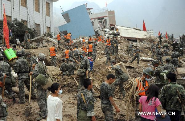 Soldiers search for survivors trapped under debris in the Aug. 7 landslides in Zhouqu County, Gannan Tibetan Autonomous Prefecture in northwest China's Gansu Province, Aug. 11, 2010. 