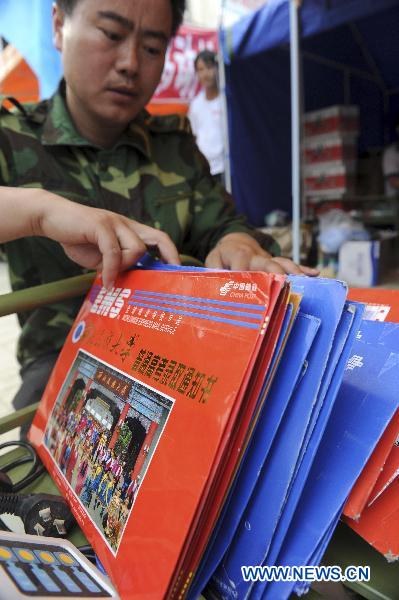 Photo taken on Aug. 11, 2010 shows a pile of college admission notice in the camp post office set up in the landslides-hit Zhouqu County, Gannan Tibetan Autonomous Prefecture in northwest China&apos;s Gansu Province. 