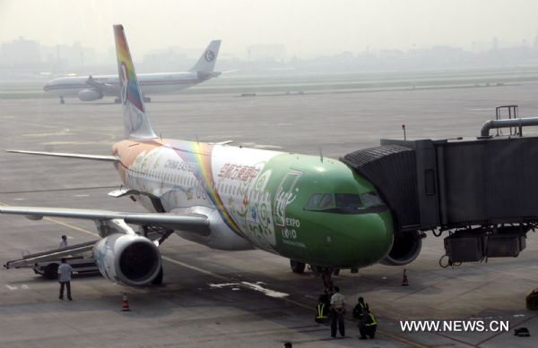 The painted plane for the World Expo waits to start its maiden flight for Kax at Hongqiao Airport in Shanghai, east China, Aug. 12, 2010. 
