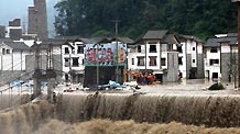 Photo taken on Aug. 14, 2010 shows the submerged buildings in Wenchuan County, southwest China's Sichuan Province. At least 38 people are missing after rain-triggered floods and landslides ravaged Wenchuan County early Saturday. Around 10,000 residents have been evacuated.
