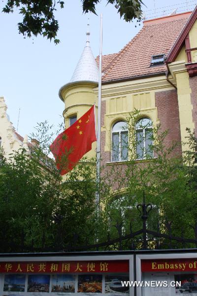 The national flag of China flies at half mast at the Chinese Embassy in Budapest, capital of Hungary, Aug. 15, 2010, to mourn for the victims of the Aug. 8 mudslide disaster in Zhouqu County, Gannan Tibetan Autonomous Prefecture in northwest China's Gansu Province.