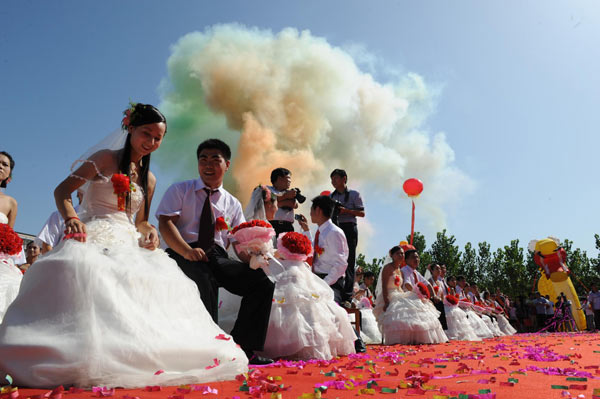 Newlyweds after a group wedding ceremony in Lushan county, central China's Henan Province, Aug 16, 2010.