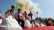 Newlyweds after a group wedding ceremony in Lushan county, central China's Henan Province, Aug 16, 2010.