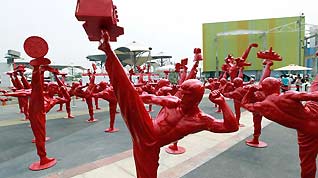 Ceramic statues of Chinese kungfu practitioners are on display at Shanghai Expo Park, Aug 17, 2010.