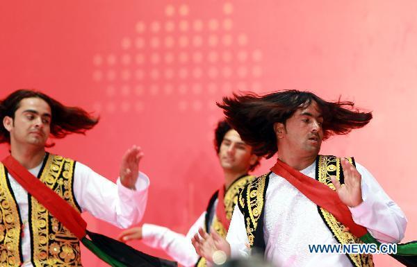 Artists from the Republic of Afghanistan perform during a ceremony celebrating the National Pavilion Day of the Republic of Afghanistan at the 2010 World Expo in Shanghai, east China, Aug. 19, 2010. 