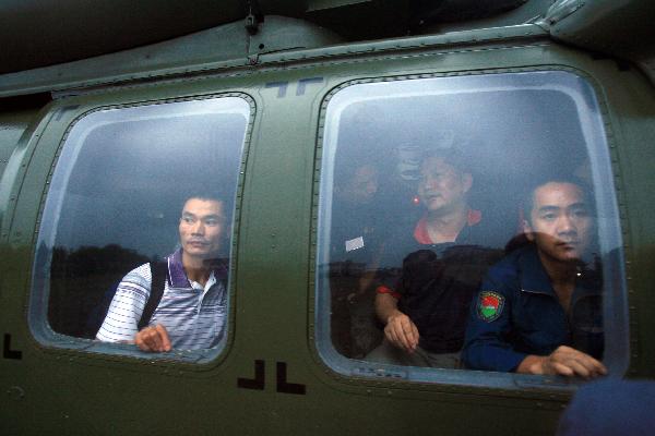 Soldiers evacuate villagers surrounded by flood to a safe place in Pujiang County, Chengdu City, capital of southwest China's Sichuan Province, Aug. 19, 2010.