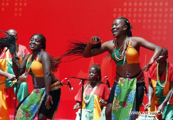 Togolese performers perform at the ceremony celebrating the National Pavilion Day for the Republic of Togo at the 2010 World Expo in Shanghai, east China, Aug.20, 2010.