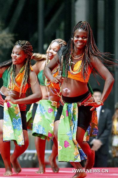 Togolese performers perform at the ceremony celebrating the National Pavilion Day for the Republic of Togo at the 2010 World Expo in Shanghai, east China, Aug.20, 2010.