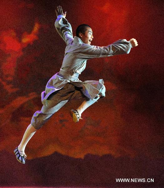 A monk from the Shaolin Temple performs Shaolin Martial Arts Show at the Entertainment Hall of the World Expo Park, in Shanghai, east China, Aug. 19, 2010. 