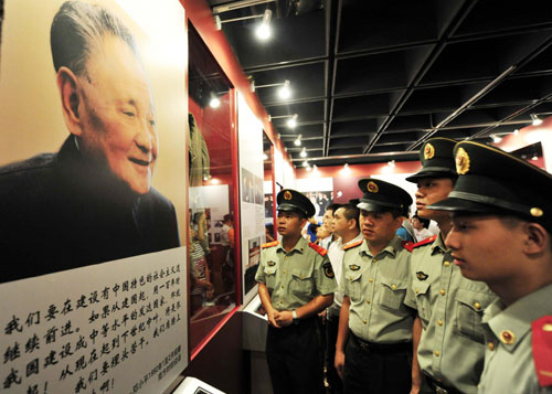 Frontier soldiers visit an exhibition commemorating the late Chinese leader Deng Xiaoping, known as the paramount leader of China's reform and opening-up in Shenzhen, the country's first special economic zone in south China's Guangdong Province August 22, 2010. 