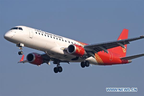 File photo taken in December of 2009 in Xiaoshan airport of east China&apos;s Zhejiang Province shows an EMBRAER ERJ-190 of Henan Airlines.