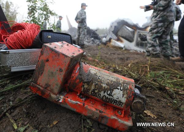 The black-box of a crashed passenger plane is found in Yichun City, northeast China's Heilongjiang Province, Aug. 25, 2010.
