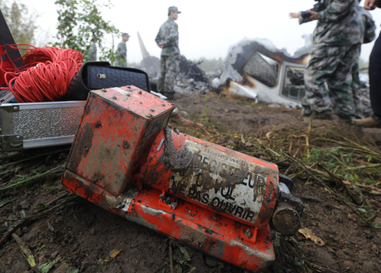 The black box of a crashed plane in northeast China's Heilongjiang Province was found Wednesday morning, Xinhua photographers at the scene said Wednesday. The Henan Airlines plane with 91 passengers and five crew crashed late Tuesday near the Lindu airport on the outskirts of Yichun, killing 42 people and injuring 54 others. [Xihhua photo]