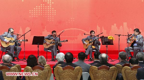 Uruguayan people perform during a ceremony marking the National Pavilion Day of Uruguay at the 2010 World Expo in Shanghai, east China, Aug. 25, 2010.