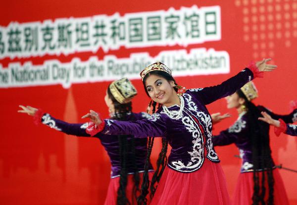 Dancers perform during a ceremony marking the National Pavilion Day for Uzbekistan at the 2010 World Expo in Shanghai, east China, Aug. 31, 2010. 