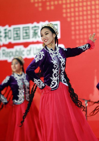 Dancers perform during a ceremony marking the National Pavilion Day for Uzbekistan at the 2010 World Expo in Shanghai, east China, Aug. 31, 2010. 