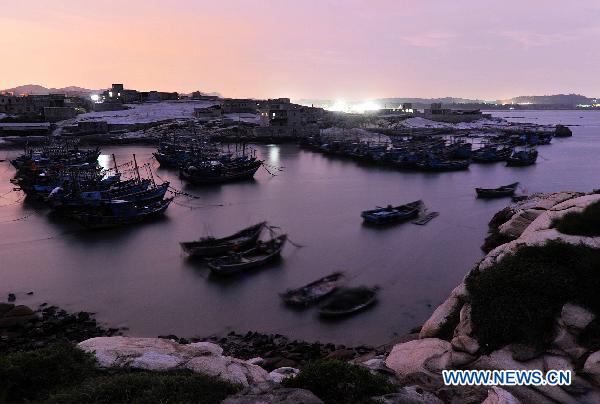 Fishing boats stay in harbor at Shadi Village of Yongning Town, southeast China's Fujian Province, on Sept. 1, 2010.