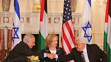 Israeli Prime Minister Benjamin Netanyahu (L) shakes hands with Palestinian National Authority Chairman Mahmoud Abbas (R) as US Secretary of State Hillary Clinton looks on during the launching ceremony of the direct negotiation between Palestine and Israel at the US State Department in Washington DC, the United States, Sept. 2, 2010.