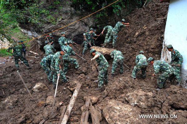Rescuers work at the scene of landslide at Dashifang Village in Baoshan City, southwest China's Yunnan Province, Sept. 2, 2010. The landslide happening on the night of Sept. 1 has left at least eight people dead and 40 others missing. (Xinhua/Chen Haining) (wxy) 