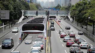 Artistic rendering of the 'straddle bus'. The 'straddle bus' spans two of traffic lanes and sits at a height of 4.5 meters. It will be used on major roads in cities and may reduce road traffic by 20 to 30 percent