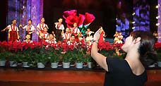 Deaf students at a special education school in Beijing's Dongcheng district participate in a performance to celebrate the upcoming Teachers Day, Sept 7, 2010.