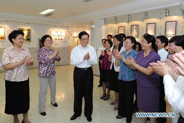 Chinese President Hu Jintao meets with teachers at the affiliated high school of Renmin University of China in Beijing, Sept. 9, 2010.