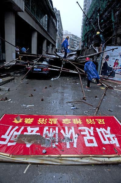 Workers clear off a scaffold damaged by the typhoon Meranti in downtown Jinjiang, southeast China's Fujian Province.