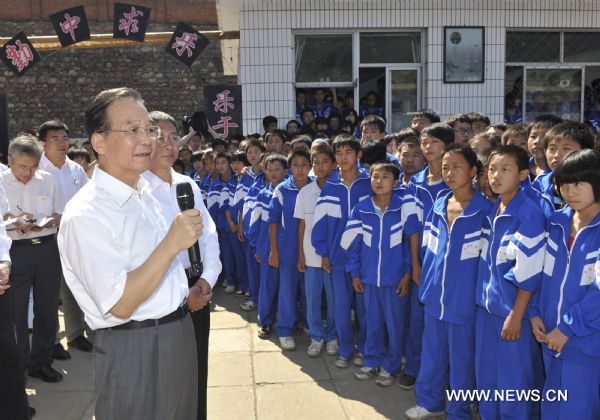 Chinese Premier Wen Jiabao speaks at a middle school in Xinglong County, north China's Hebei Province on Sept. 10, 2010. 