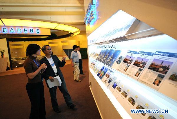 Photo taken on Sept. 12, 2010 shows information brochures are dispalyed on a shelf at Tianjin Meijiang Convention Center, main venue of the Annual Meeting of the New Champions 2010, in north China's Tianjin Municipality. 