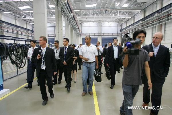 Participants of the Annual Meeting of the New Champions 2010, visit a plant of Vestas Wind Technology (China) Co., Ltd., during an industry tour as a program of the World Economic Forum (WEF) Annual Meeting of the New Champions 2010, in north China's Tianjin Municipality on Sept. 14, 2010.