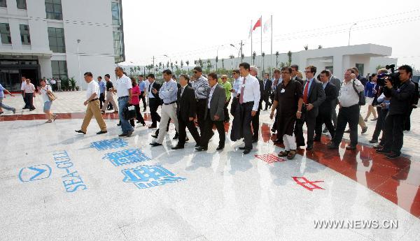 Participants of the Annual Meeting of the New Champions 2010, visit the Tianjin Seagull Watch Group Co., Ltd. during an industry tour as a program of the World Economic Forum (WEF) Annual Meeting of the New Champions 2010, in north China's Tianjin Municipality on Sept. 14, 2010.