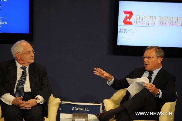 Sir Martin Sorrell (R), chief executive officer of WPP of the United Kingdom, and Martin Wolf, associate editor and chief economics commentator of the Financial Times of the United Kingdom, attend the TV debate on “Rethinking China’s Competitive Edge” of the World Economic Forum (WEF) Annual Meeting of the New Champions 2010, at Tianjin Meijiang Convention Center, in north China's Tianjin Municipality on Sept. 14, 2010.