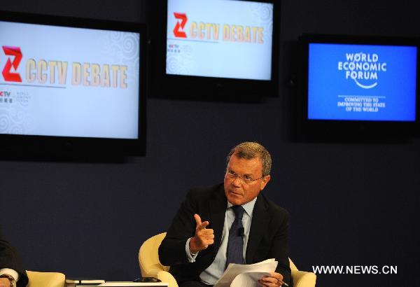 Sir Martin Sorrell, chief executive officer of WPP of the United Kingdom, makes a gesture during the TV debate on “Rethinking China’s Competitive Edge” of the World Economic Forum (WEF) Annual Meeting of the New Champions 2010, at Tianjin Meijiang Convention Center, in north China's Tianjin Municipality on Sept. 14, 2010. 