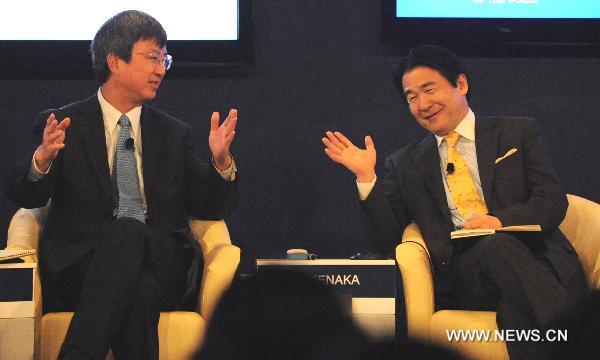 Heizo Takenaka (R), director of Global Security Research Institute of Keio University of Japan, and Zhu Min, special advisor of International Monetary Fund(IMF), attend the TV debate on “Rethinking China’s Competitive Edge” of the World Economic Forum (WEF) Annual Meeting of the New Champions 2010, at Tianjin Meijiang Convention Center, in north China's Tianjin Municipality on Sept. 14, 2010. 