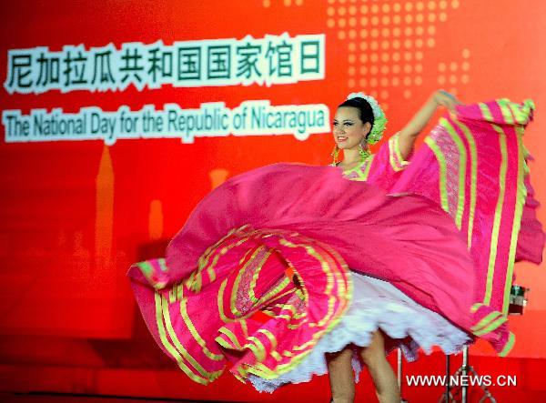 An artist from Nicaragua performs during a ceremony marking the National Pavilion Day of the Republic of Nicaragua in the Shanghai World Expo Park in Shanghai, east China, Sept. 14, 2010.