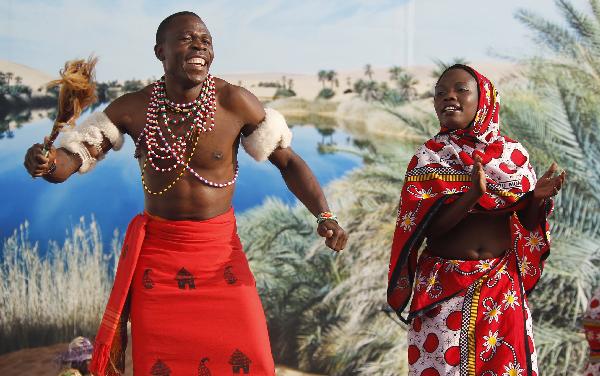 Kenyan dancers perform traditional dance in the Shanghai World Expo Park in Shanghai, east China, Sept. 16, 2010. 