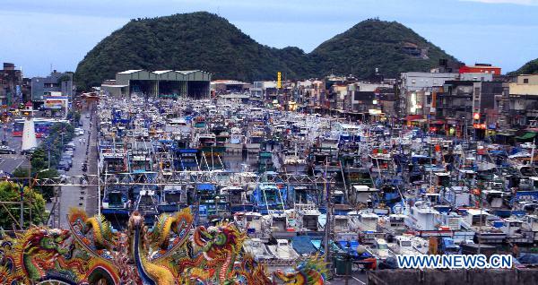 Fishing boats rest at a port in Yilan, southeast China's Taiwan, to escape from the onslaught of Fanapi, an upcoming typhoon, Sept. 18, 2010. 