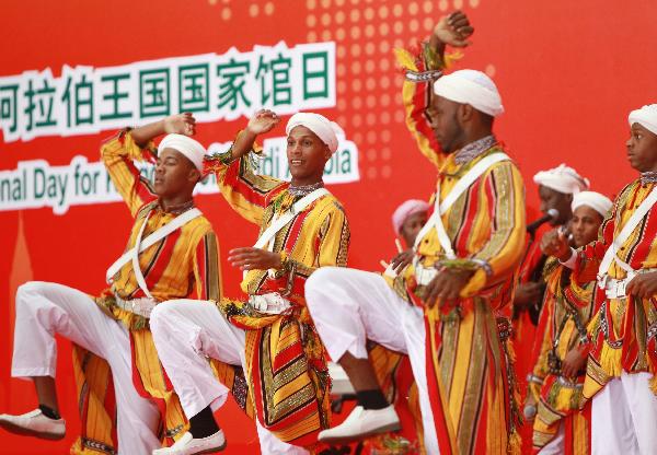 Performers from Saudi Arabia dance at a ceremony marking the National Pavilion Day for Saudi Arabia at the 2010 World Expo in Shanghai, east China, Sept. 23, 2010.