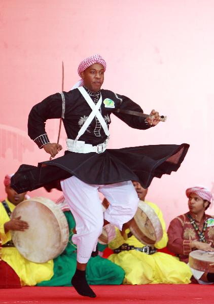 Performers from Saudi Arabia dance at a ceremony marking the National Pavilion Day for Saudi Arabia at the 2010 World Expo in Shanghai, east China, Sept. 23, 2010.