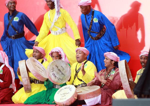 Performers from Saudi Arabia dance at a ceremony marking the National Pavilion Day for Saudi Arabia at the 2010 World Expo in Shanghai, east China, Sept. 23, 2010.