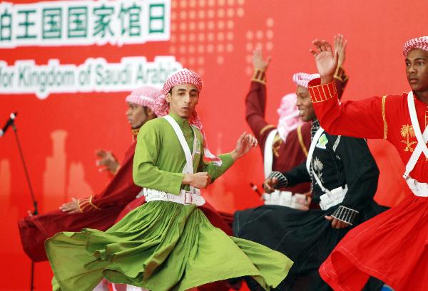 Performers from Saudi Arabia dance at a ceremony marking the National Pavilion Day for Saudi Arabia at the 2010 World Expo in Shanghai, east China, Sept. 23, 2010.